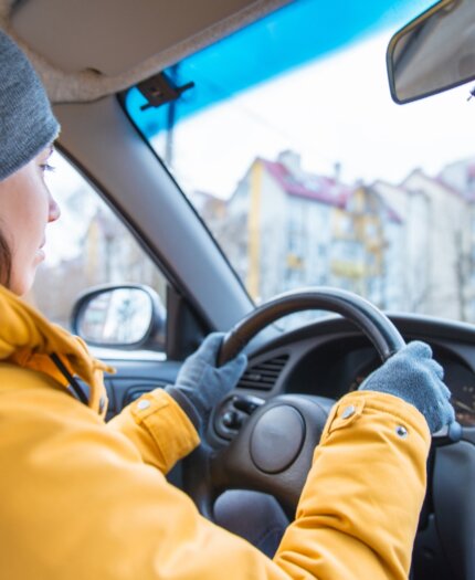 Driving In Adverse Conditions-image1 Young woman learning to drive in winter conditions